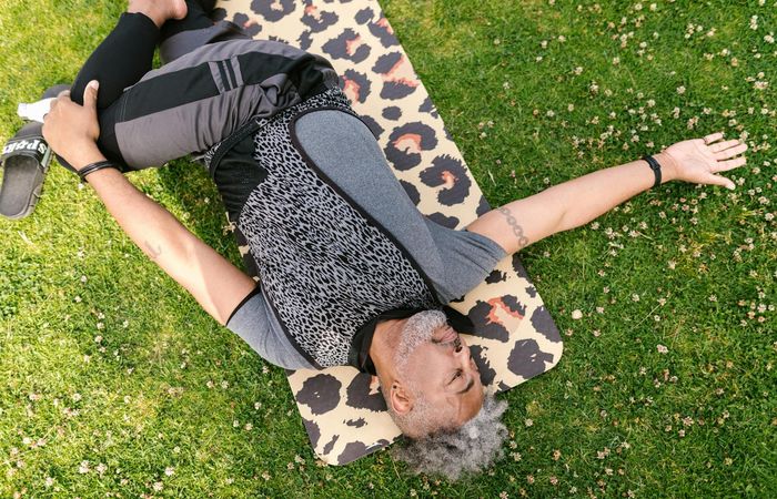 Man stretching outdoors feeling refreshed and flexible.